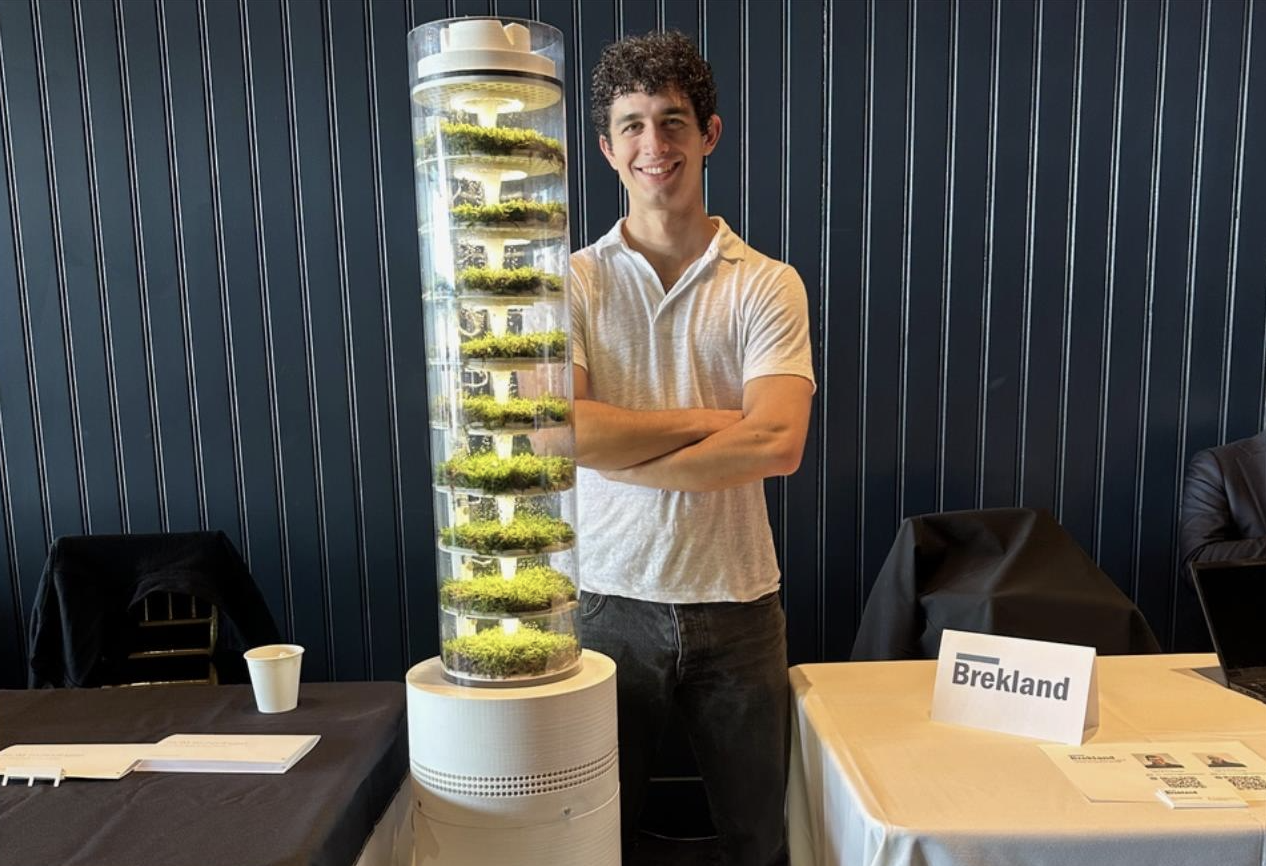 Will Pepi stands next his Biom air filtration system at a trade show